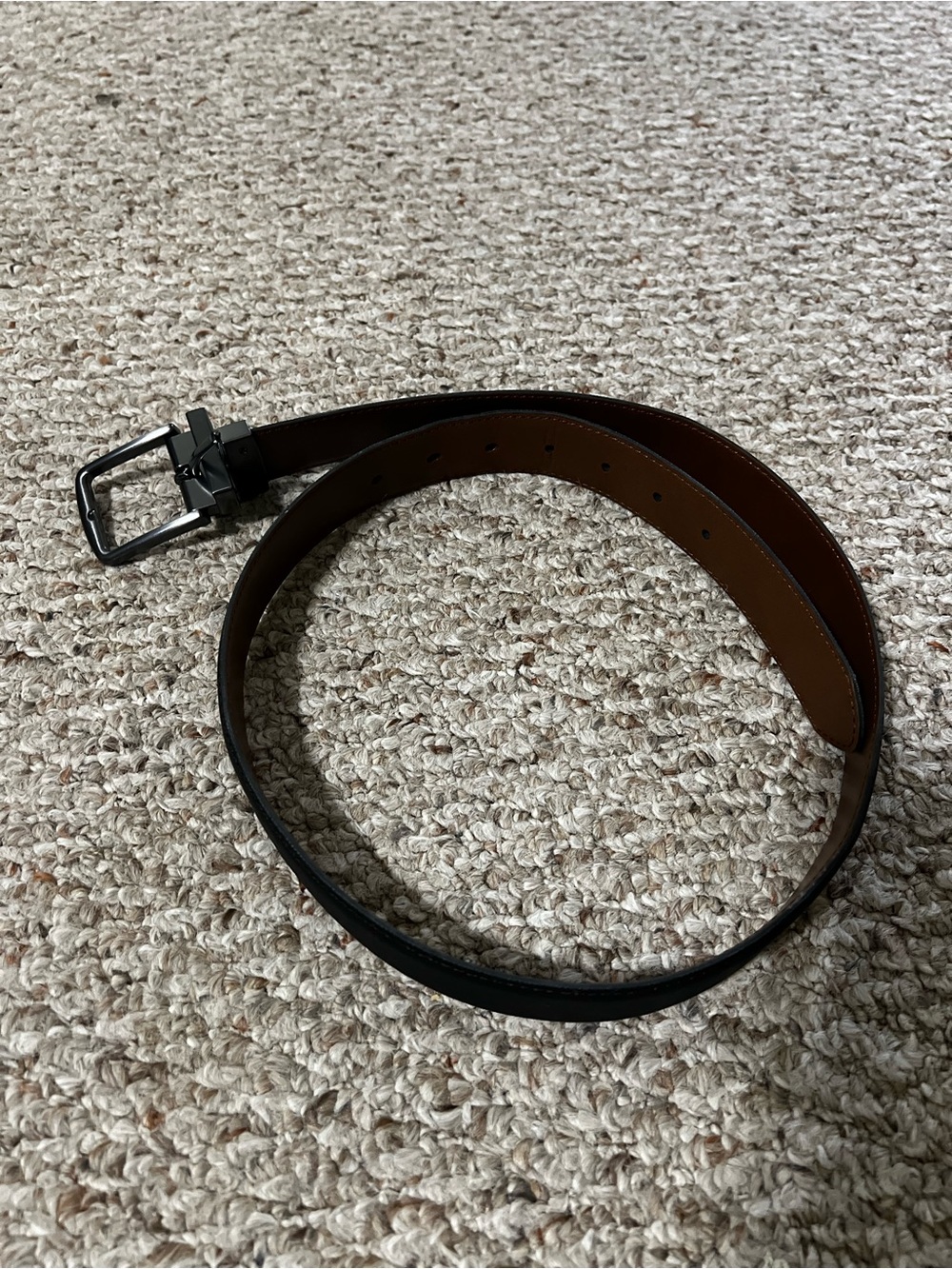 Brown/Black reversible belt. Size small. Heavy gray buckle. Great condition.